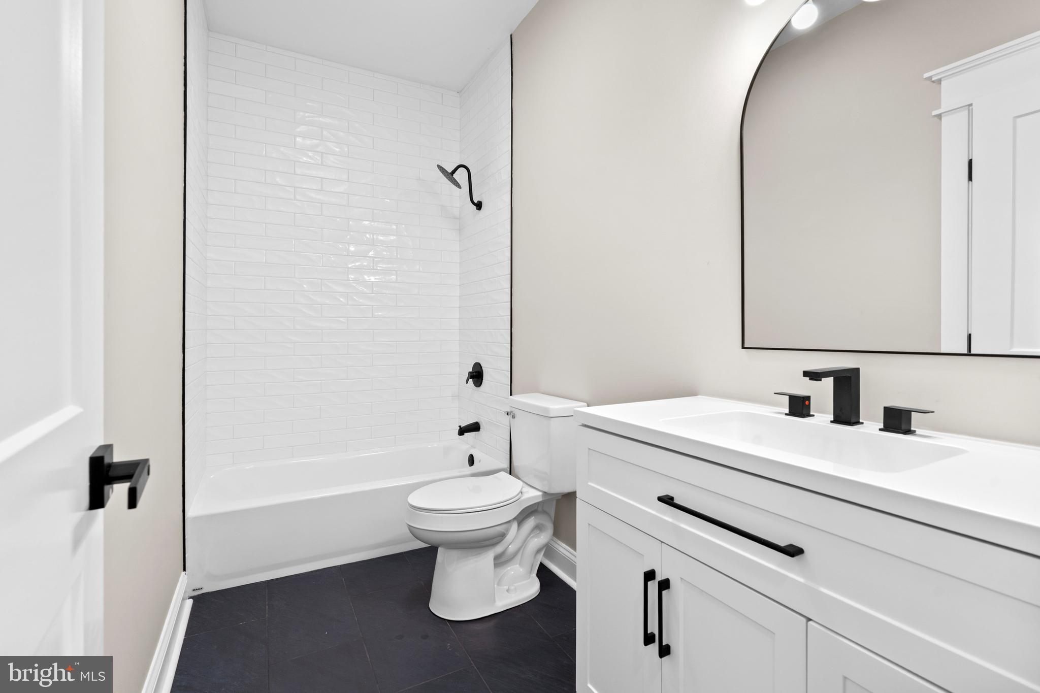 89 Parkside Terrace Berkeley Springs, WV 25411 - Photo 3 of 32 a bathroom with a sink toilet a mirror and shower