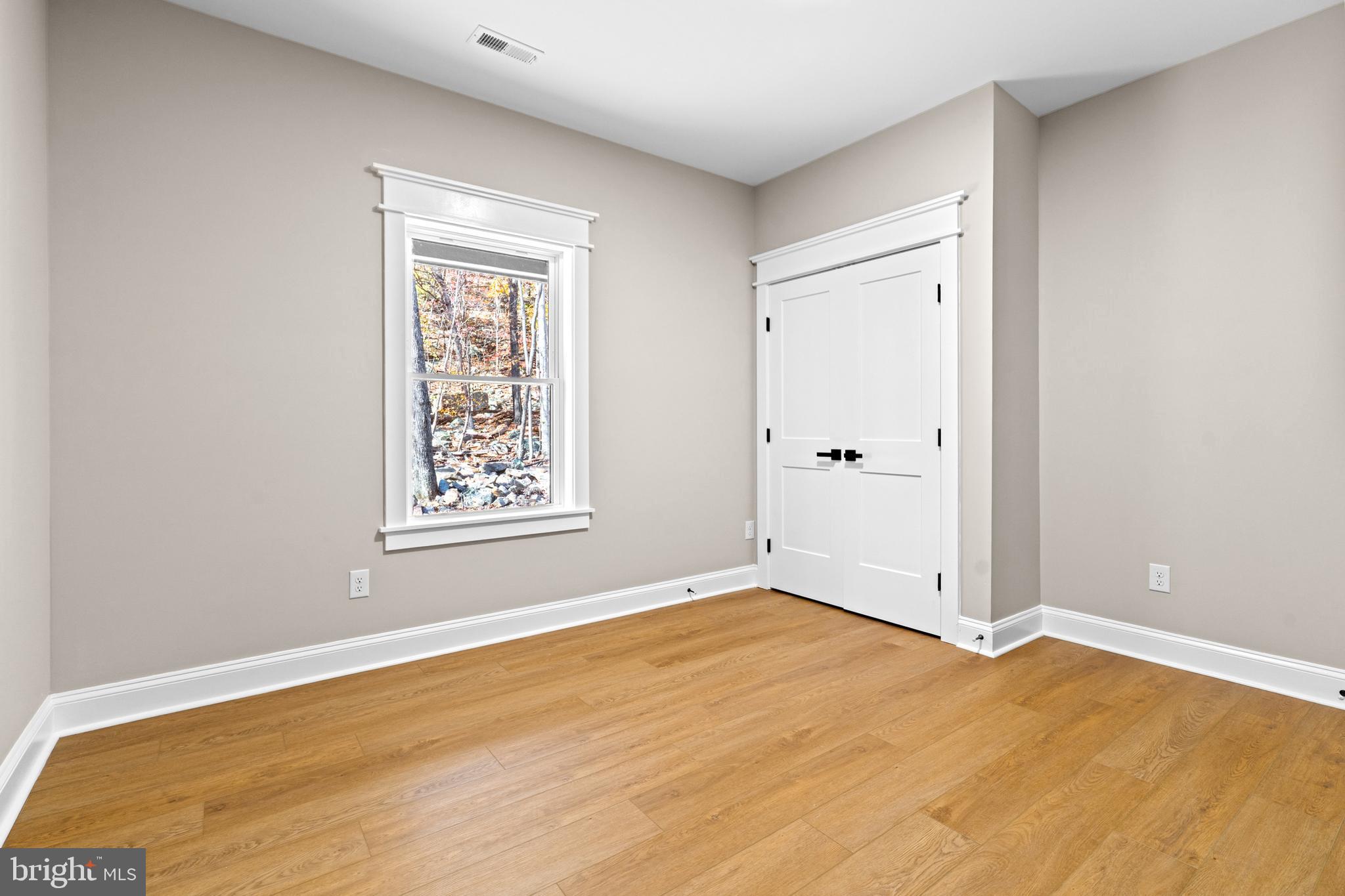 89 Parkside Terrace Berkeley Springs, WV 25411 - Photo 6 of 32 a view of an empty room with window