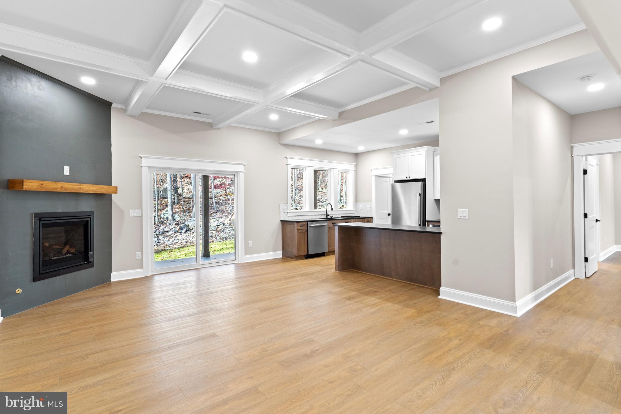 89 Parkside Terrace Berkeley Springs, WV 25411 - Photo 9 of 32 a view of an empty room with a fireplace and a window