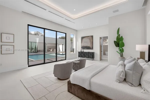 a white bath tub sitting next to a window