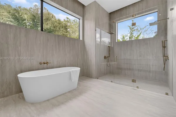 a bathroom with a toilet sink and shower