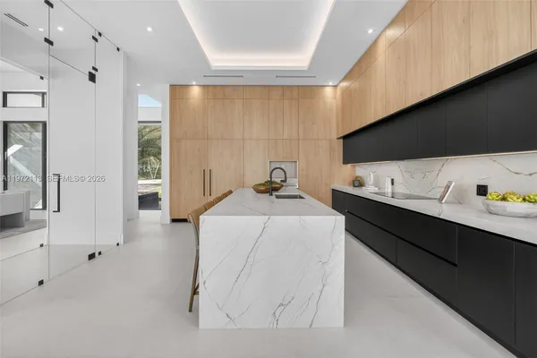 a kitchen with cabinets and window