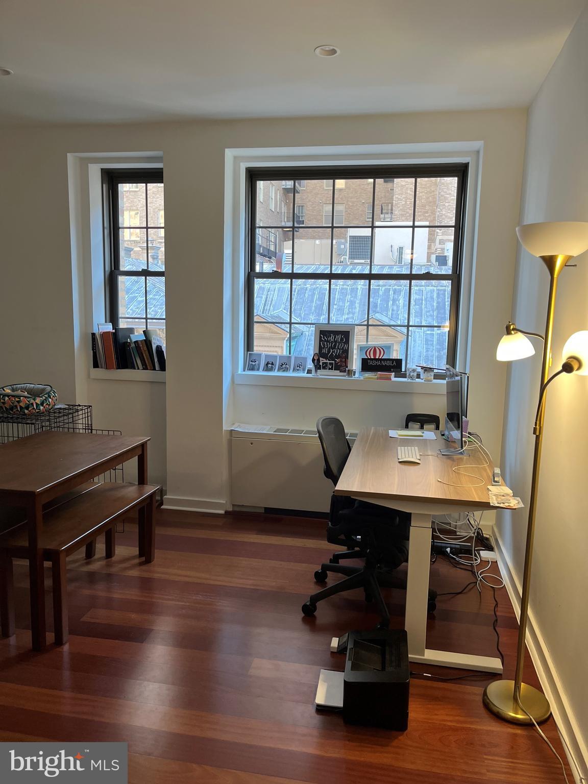 a workspace with furniture and window