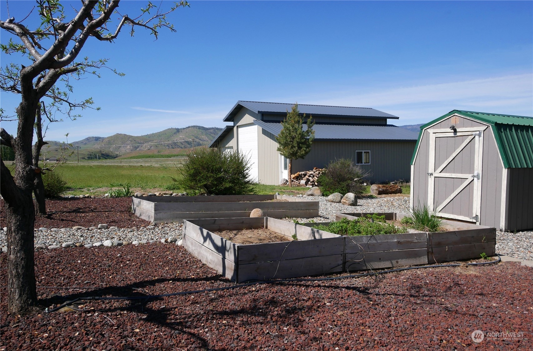 20 Blue Heron Lane Riverside, WA 98849 - Photo 36 of 40 a view of house with backyard and a patio