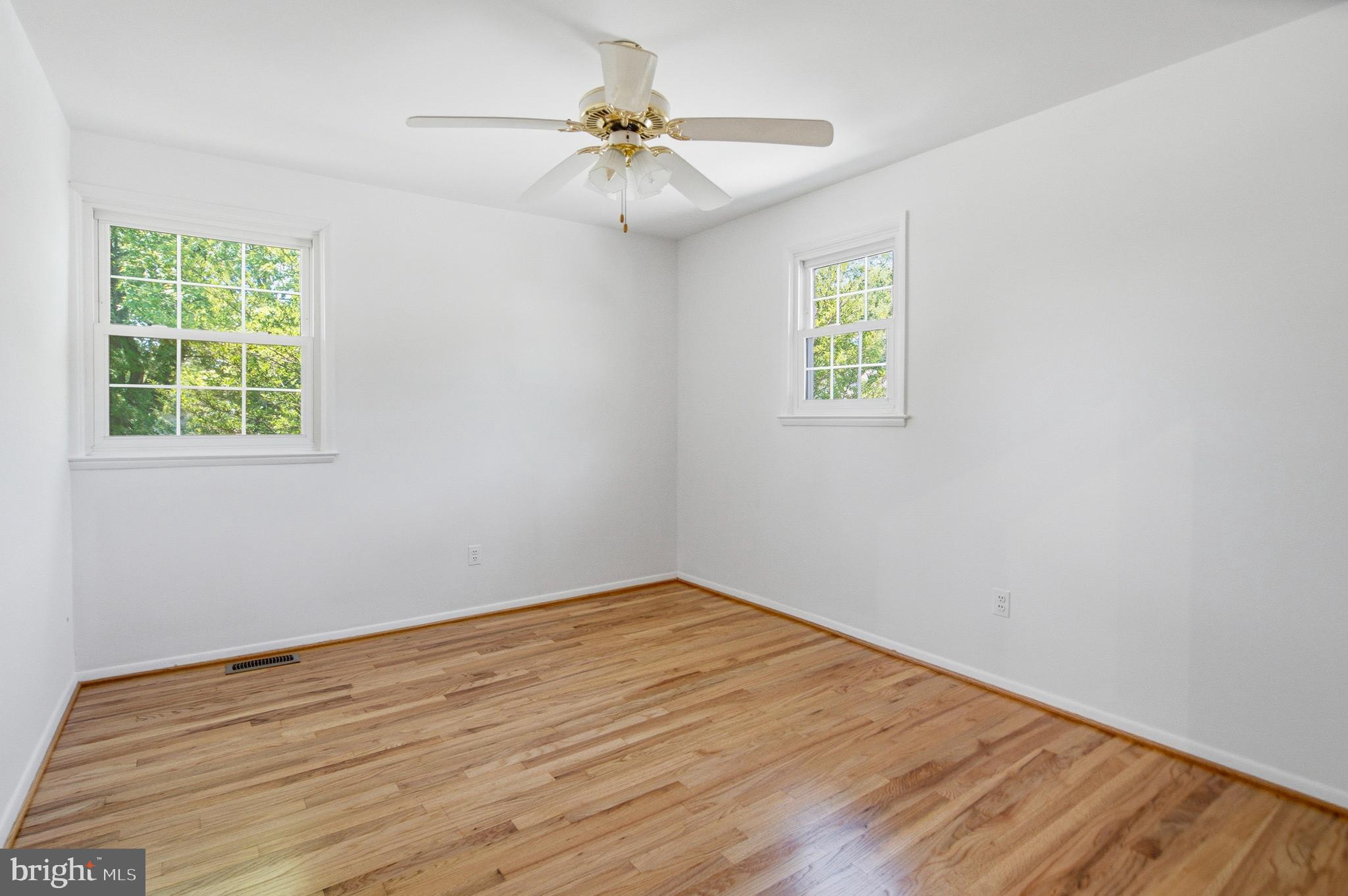 220 Solway Road Lutherville-Timonium, MD 21093 - Photo 16 of 38 an empty room with a window and a ceiling fan