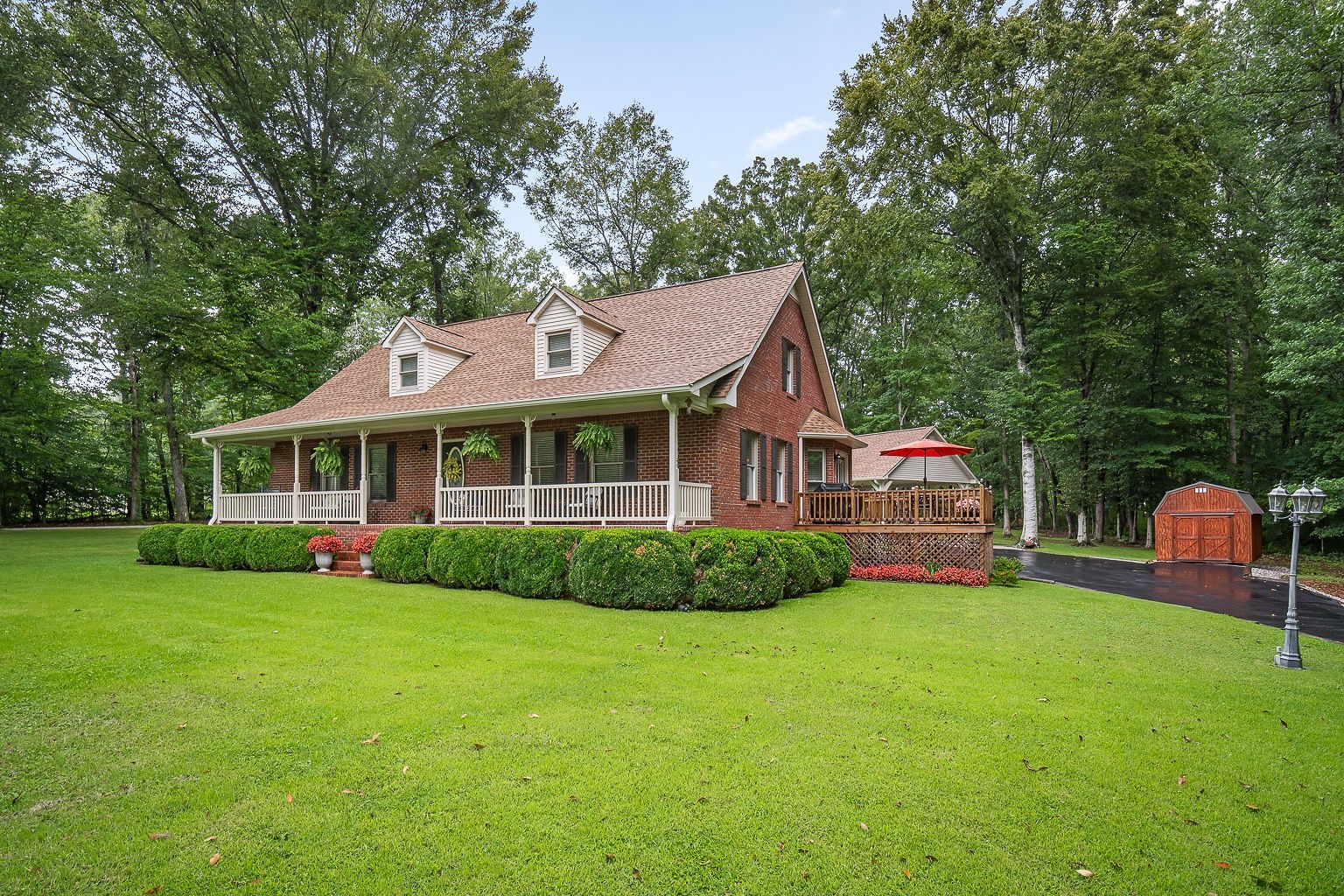 715 Old Rock Island Road Rock Island, TN 38581 - Photo 1 of 48 a front view of a house with a yard table and chairs