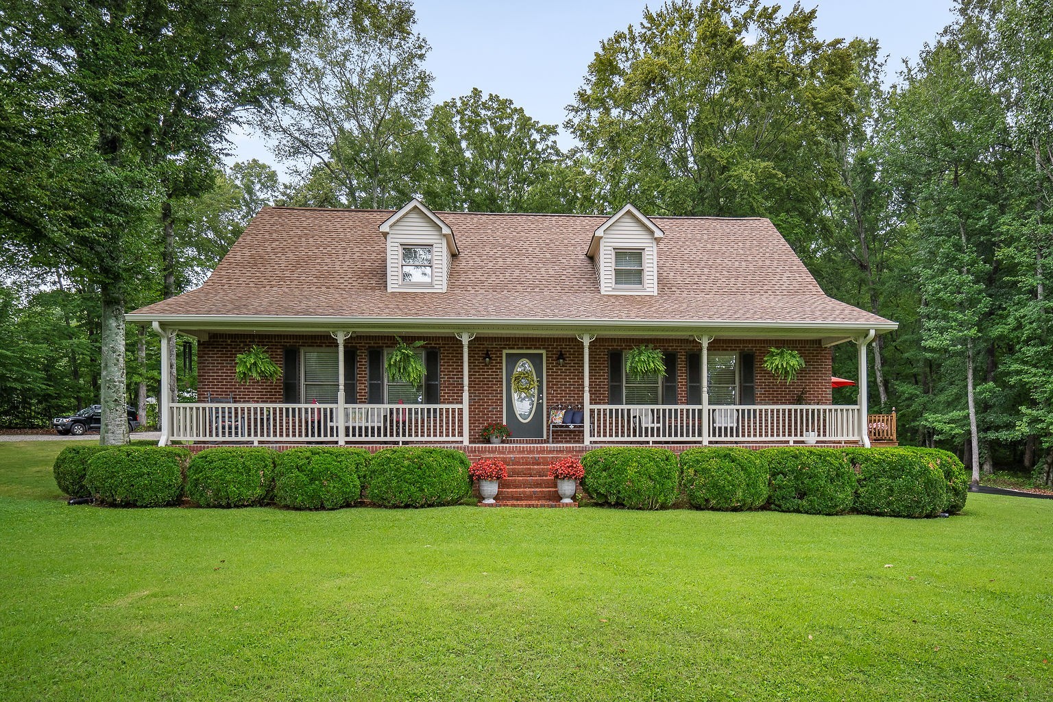 715 Old Rock Island Road Rock Island, TN 38581 - Photo 2 of 48 a front view of a house with a garden