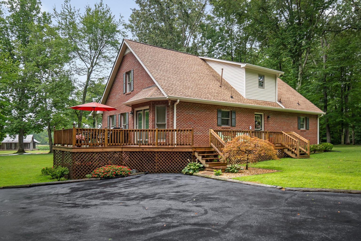 715 Old Rock Island Road Rock Island, TN 38581 - Photo 34 of 48 a front view of a house with a yard and garage