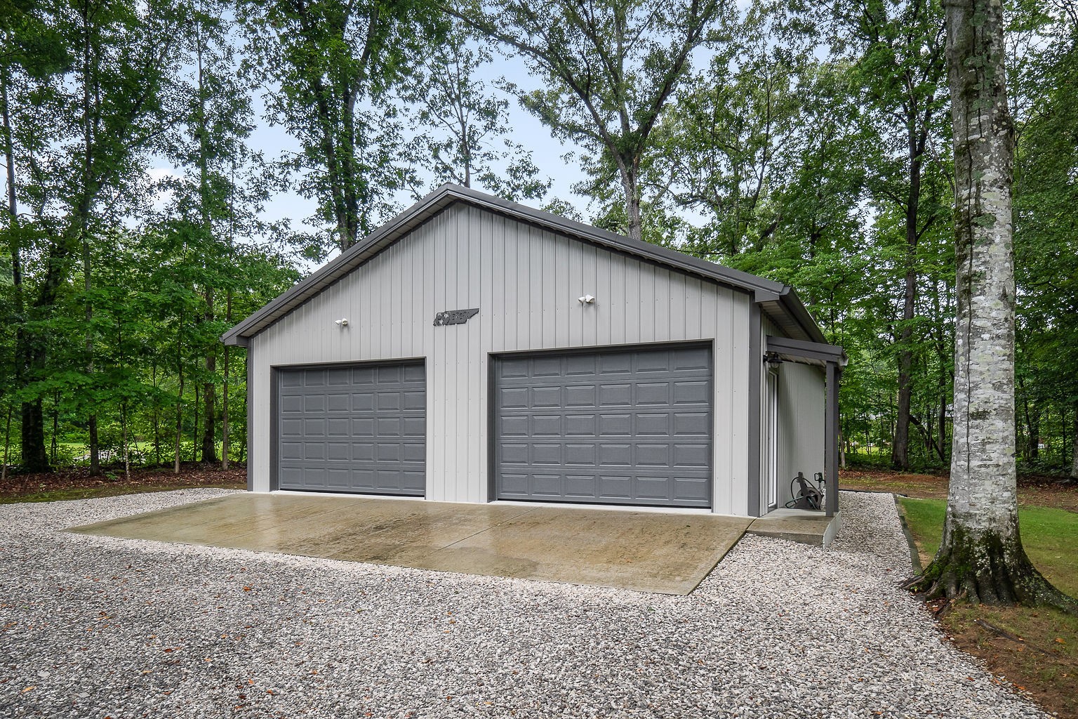 715 Old Rock Island Road Rock Island, TN 38581 - Photo 38 of 48 a front view of a house with a yard and garage