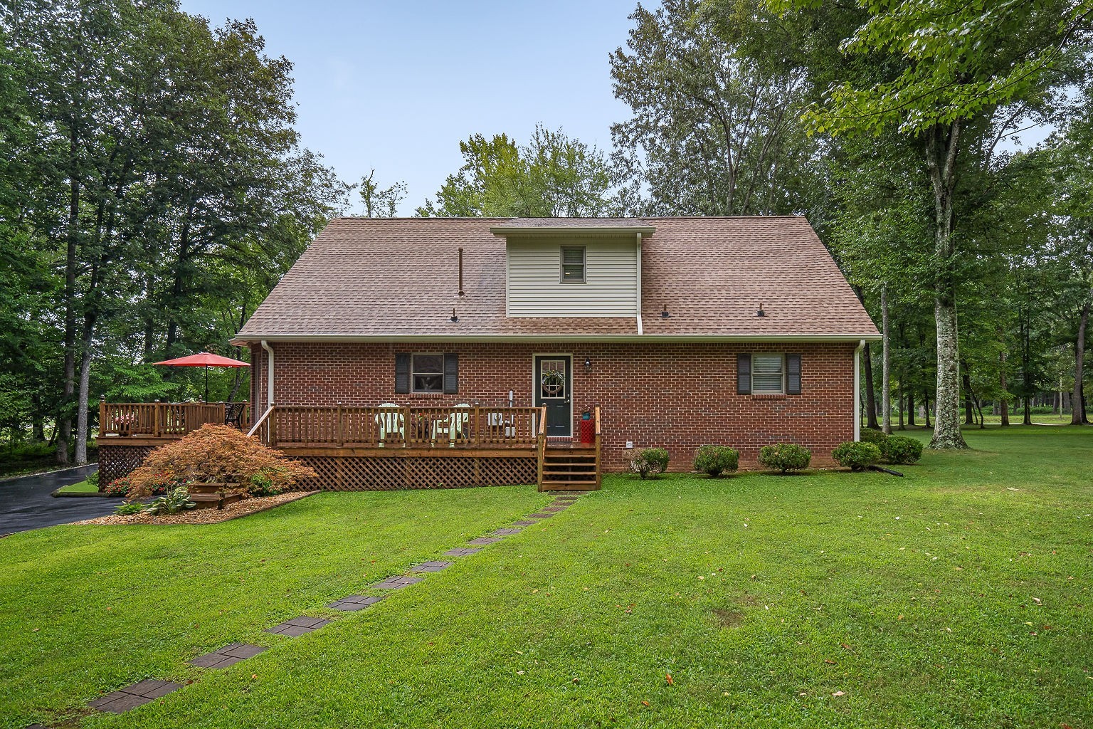715 Old Rock Island Road Rock Island, TN 38581 - Photo 43 of 48 a front view of a house with a yard and trees