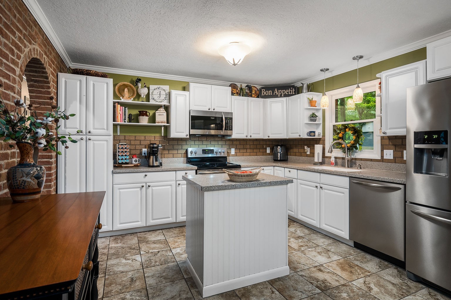 715 Old Rock Island Road Rock Island, TN 38581 - Photo 8 of 48 a kitchen with stainless steel appliances granite countertop a refrigerator a stove top oven a sink and dishwasher