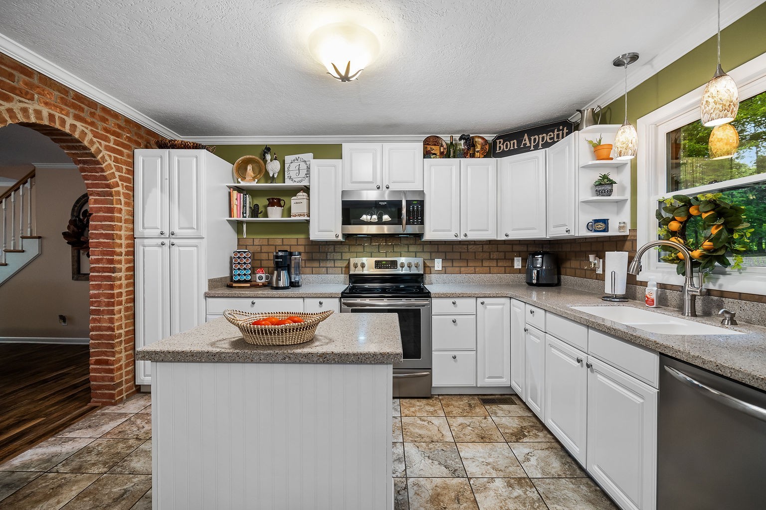 715 Old Rock Island Road Rock Island, TN 38581 - Photo 9 of 48 a kitchen with stainless steel appliances granite countertop a refrigerator a stove top oven a sink and dishwasher