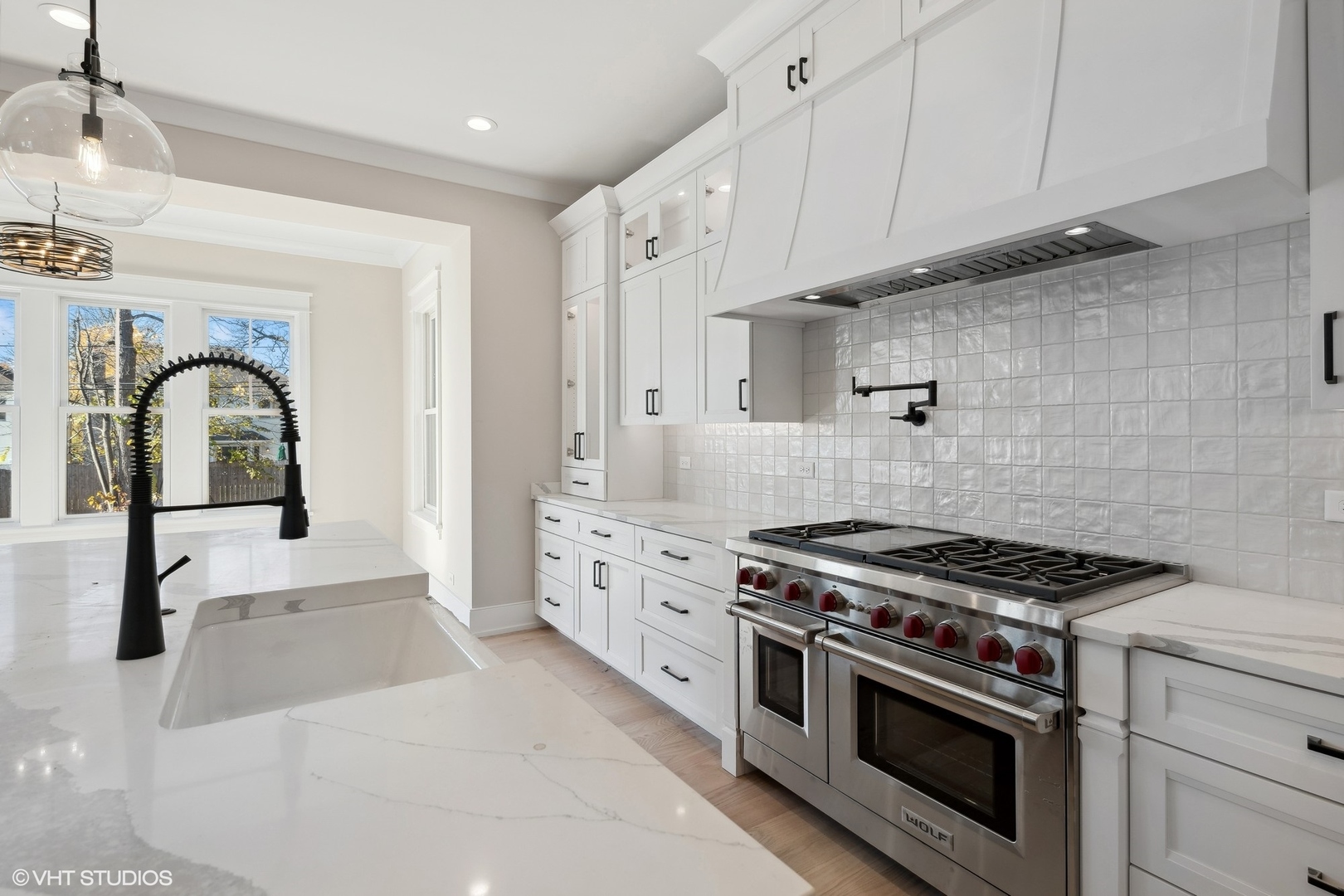 648 Saylor Avenue Elmhurst, IL 60126 - Photo 12 of 27 a kitchen with stainless steel appliances granite countertop a stove and a white cabinets