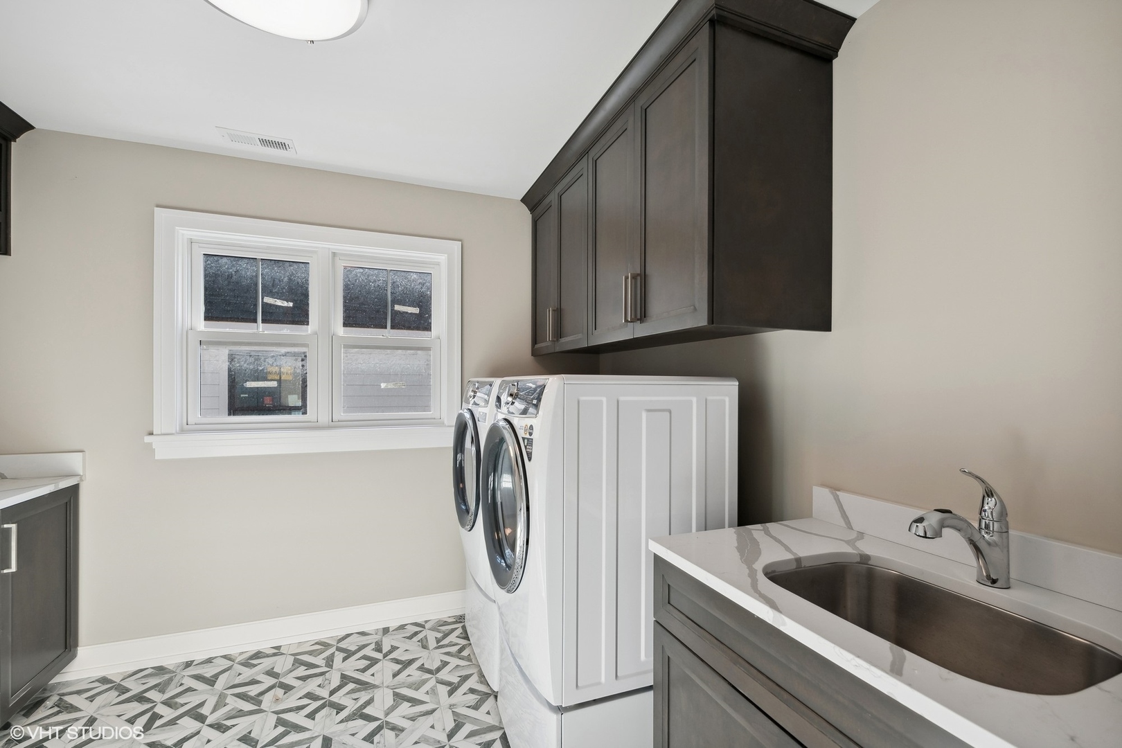 648 Saylor Avenue Elmhurst, IL 60126 - Photo 15 of 27 a kitchen with a sink and a refrigerator