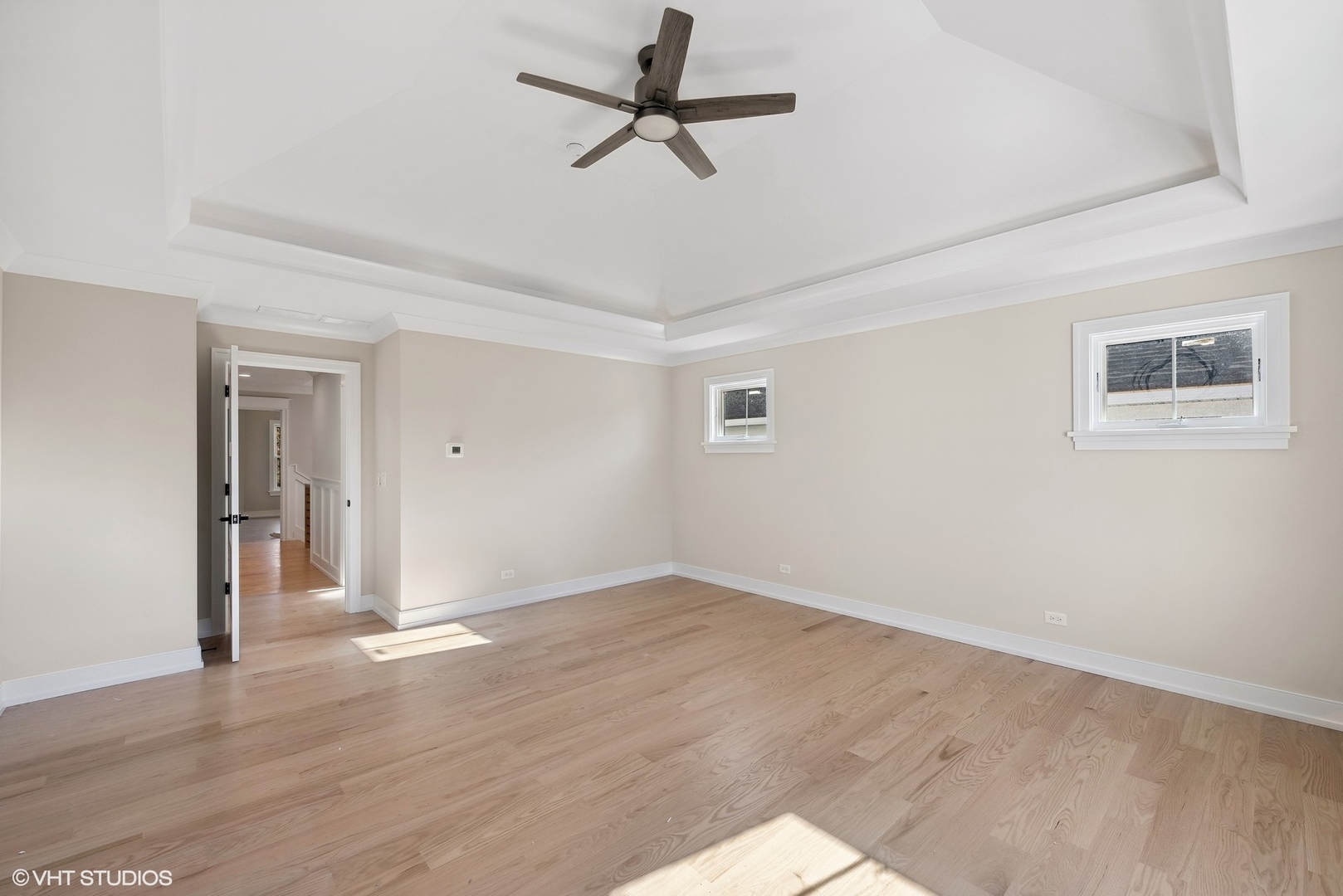 648 Saylor Avenue Elmhurst, IL 60126 - Photo 17 of 27 a view of a room with wooden floor and a ceiling fan