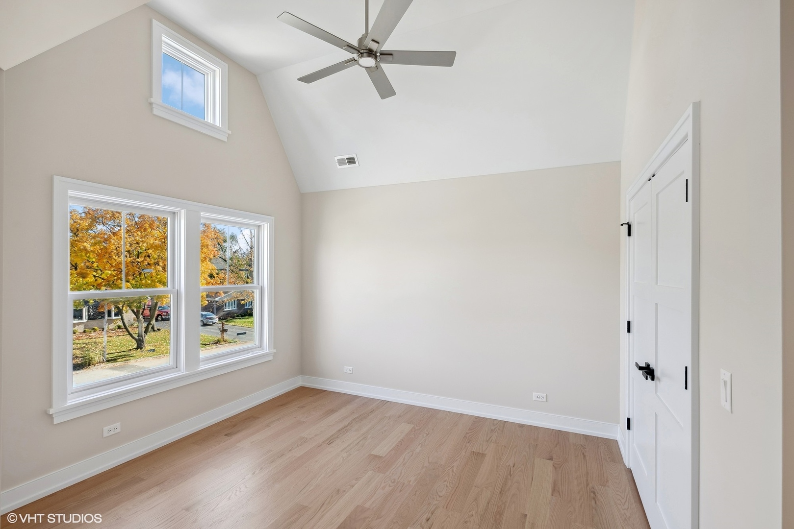 648 Saylor Avenue Elmhurst, IL 60126 - Photo 22 of 27 a view of an empty room with a window and wooden floor