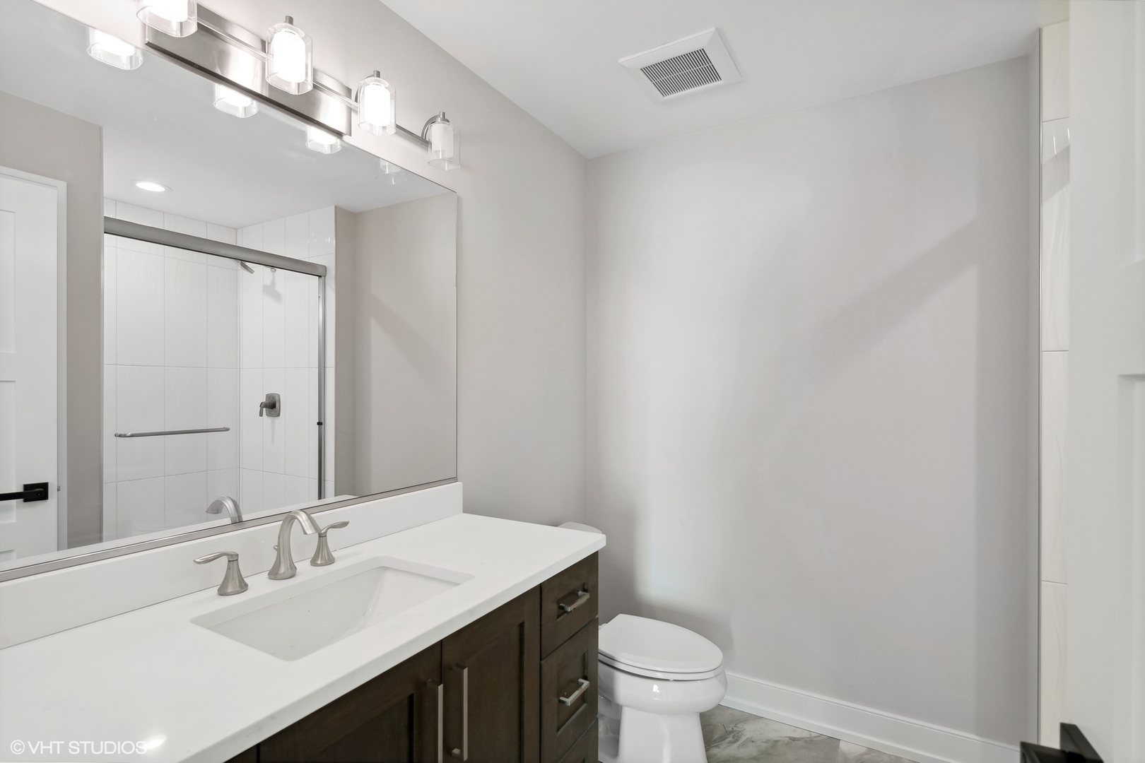 648 Saylor Avenue Elmhurst, IL 60126 - Photo 25 of 27 a bathroom with a sink a toilet and a mirror