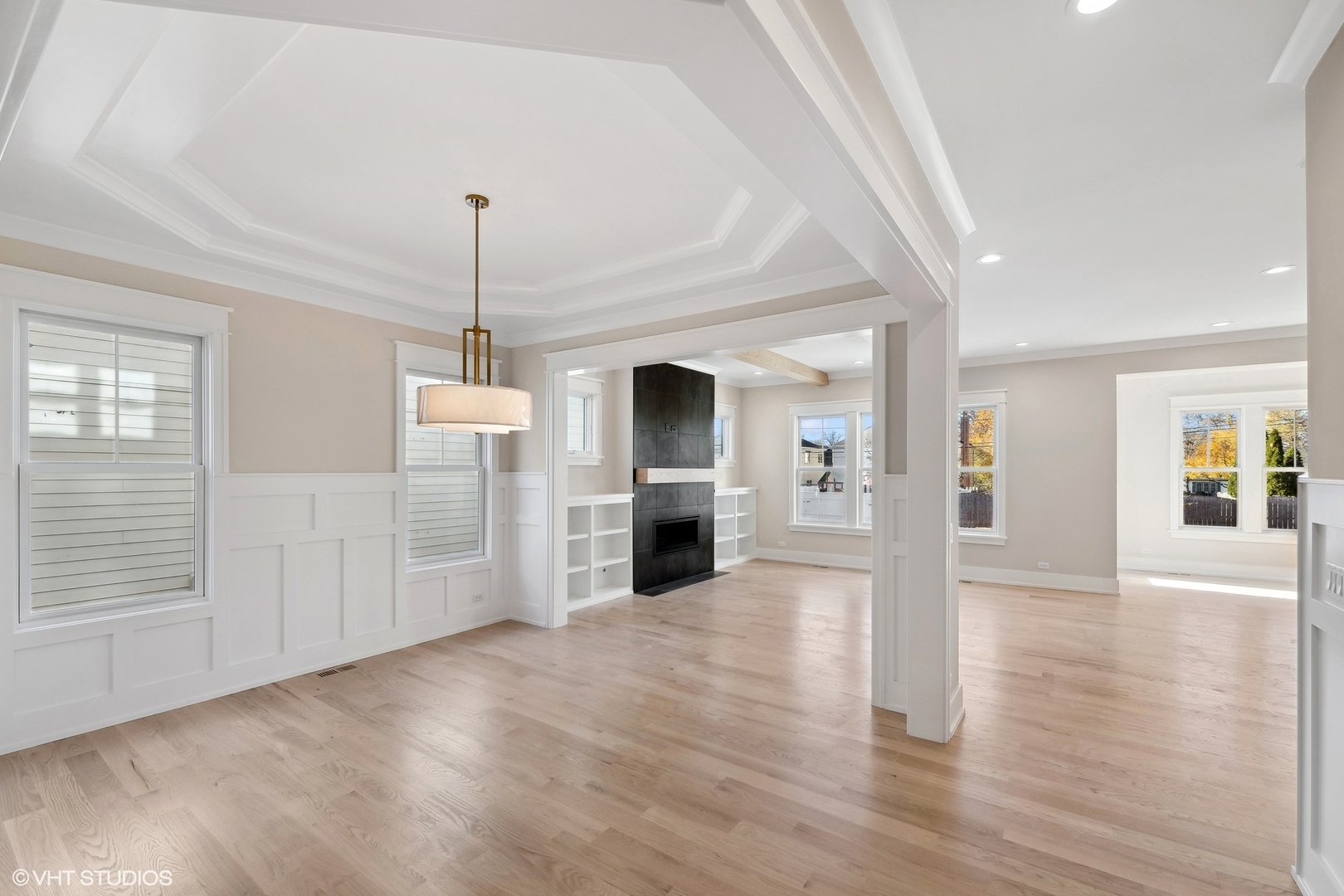 648 Saylor Avenue Elmhurst, IL 60126 - Photo 6 of 27 an empty room with wooden floor fireplace and windows