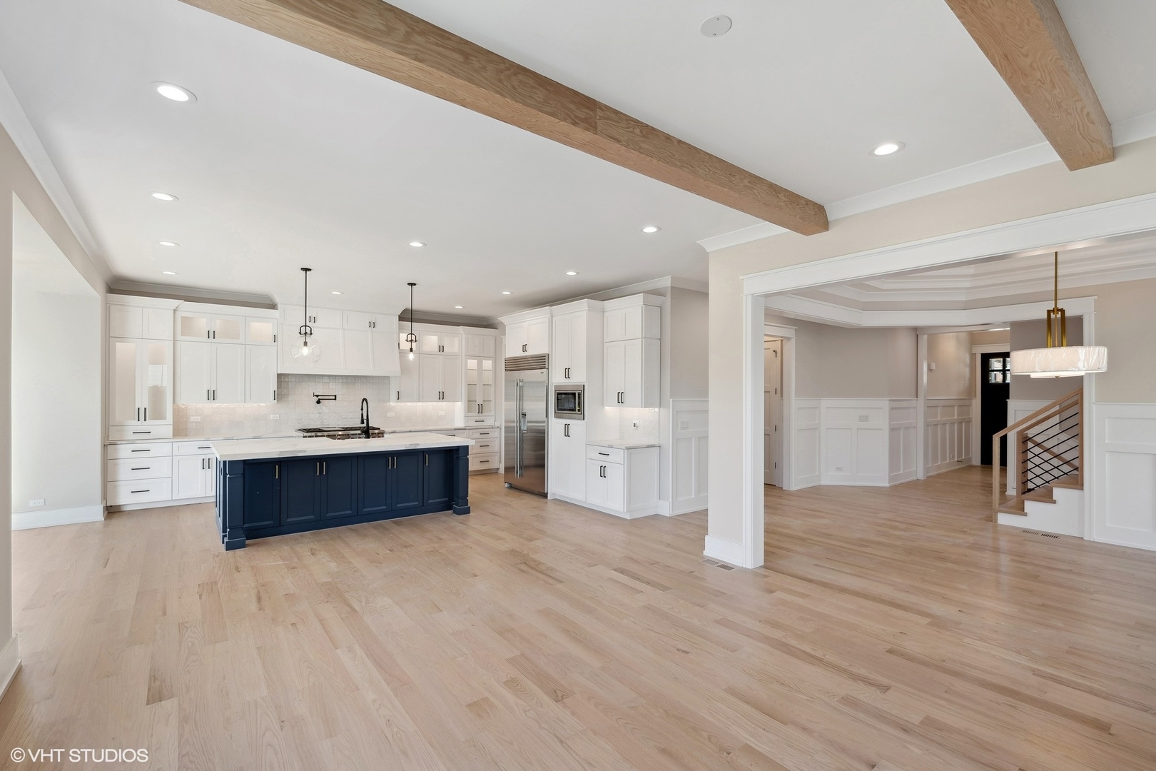 648 Saylor Avenue Elmhurst, IL 60126 - Photo 7 of 27 a large kitchen with stainless steel appliances granite countertop a large counter top and wooden floors