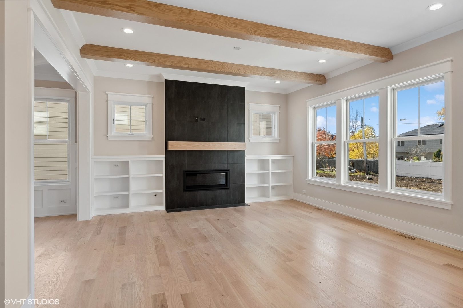 648 Saylor Avenue Elmhurst, IL 60126 - Photo 8 of 27 a view of an empty room with a fireplace and a window