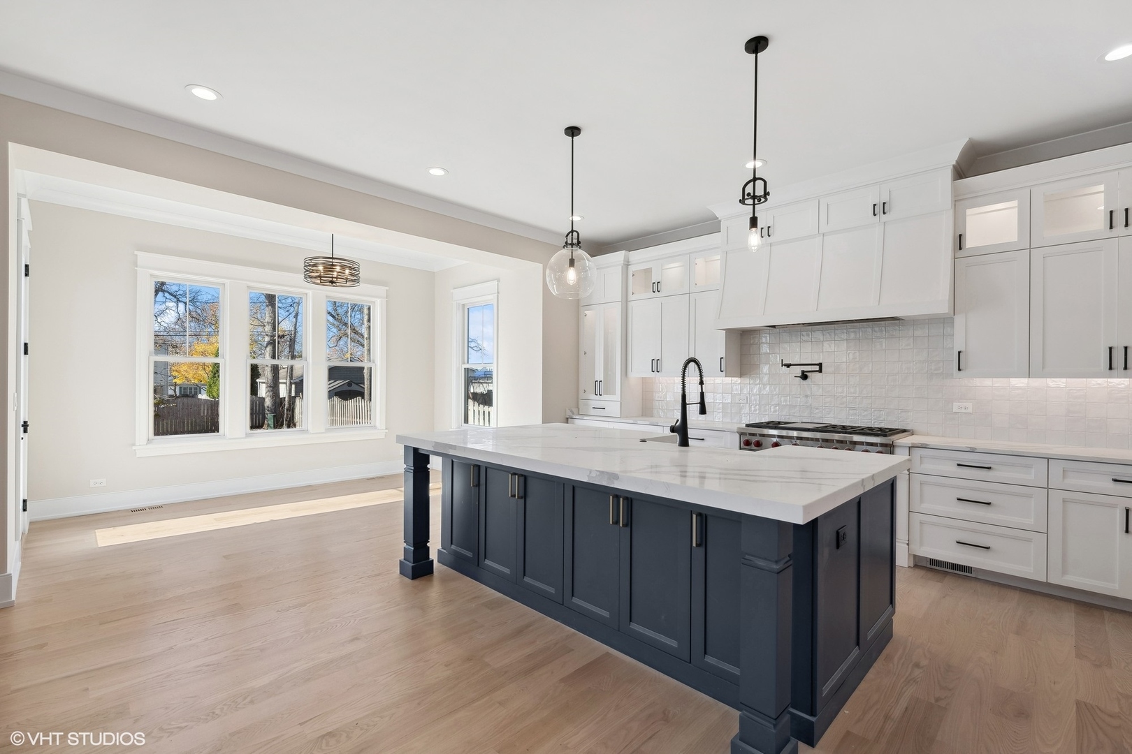 648 Saylor Avenue Elmhurst, IL 60126 - Photo 10 of 27 a kitchen with a sink stove and wooden floor