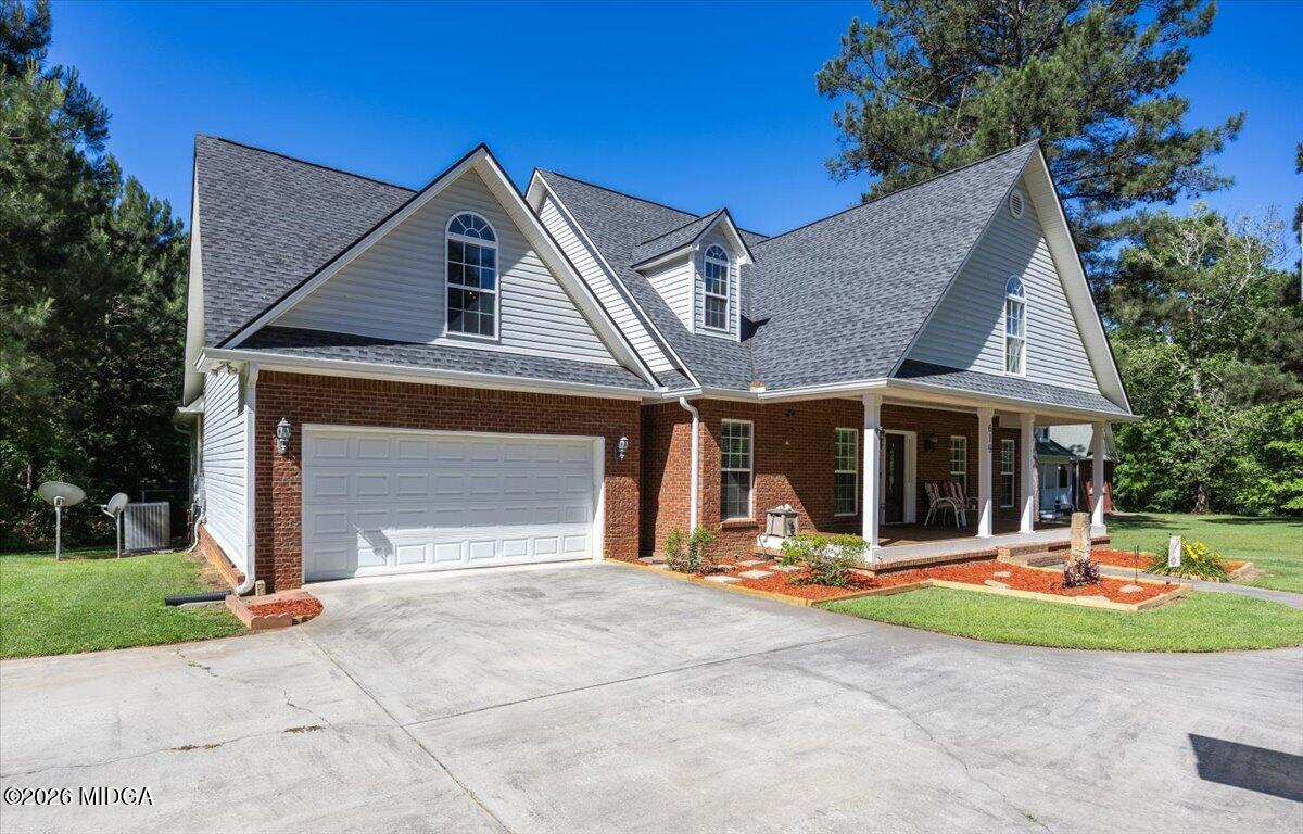 619 Grayridge Road Gray, GA 31032 - Photo 3 of 40 a front view of a house with a yard