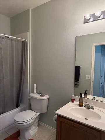 a bathroom with a toilet a sink and a shower
