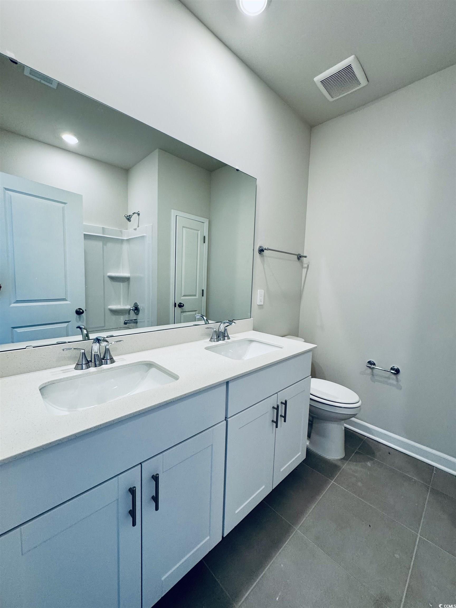 2032 Copper Crk Loop Longs, SC 29568 - Photo 6 of 36 Bathroom with visible vents, a sink, toilet, and a