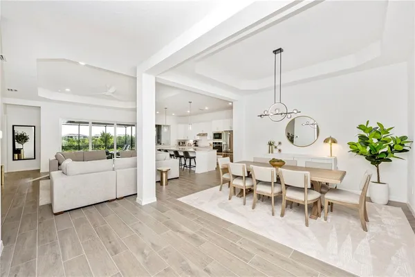 a bedroom with a bed and a flat tv screen on the dresser