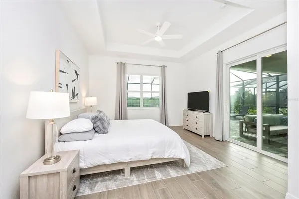 a bathroom with a granite countertop sink toilet and a mirror