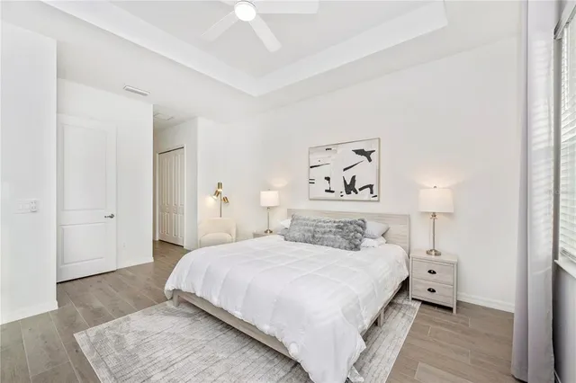 a bathroom with a sink a toilet a mirror a bathtub and shower