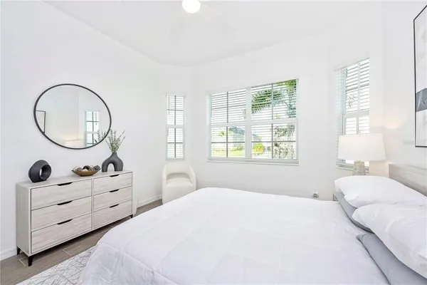 a living room with furniture tv and a large window