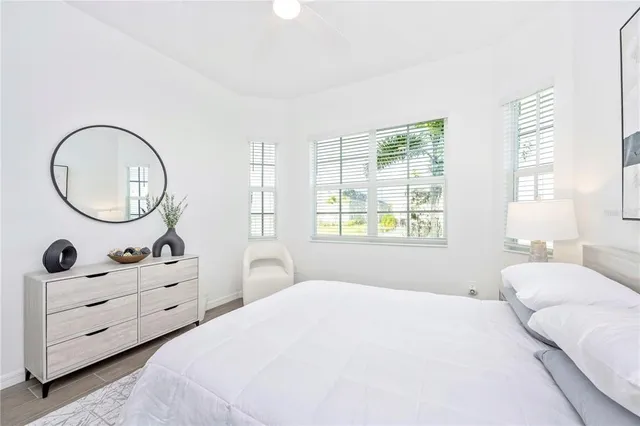 a living room with furniture tv and a large window