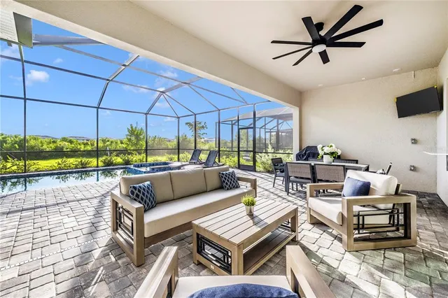 a view of a dining room with furniture window and outside view