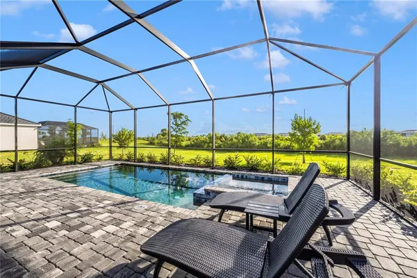 a living room with lots of furniture and a chandelier
