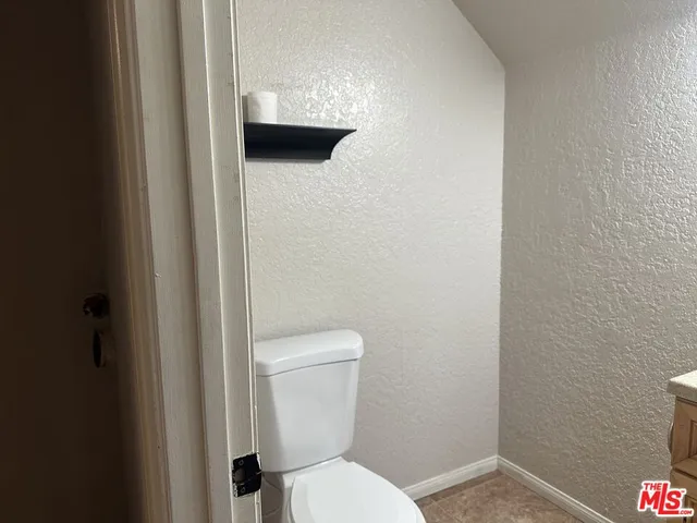 a bathroom with a shower and a toilet