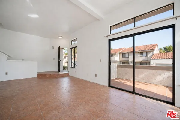 a view of a kitchen with a sink and a window