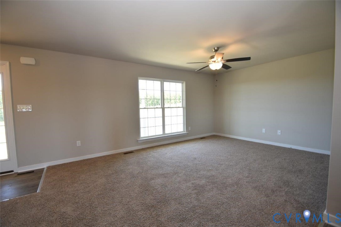 2570 Doctors Road Louisa, VA 23093 - Photo 12 of 17 an empty room with windows and fan