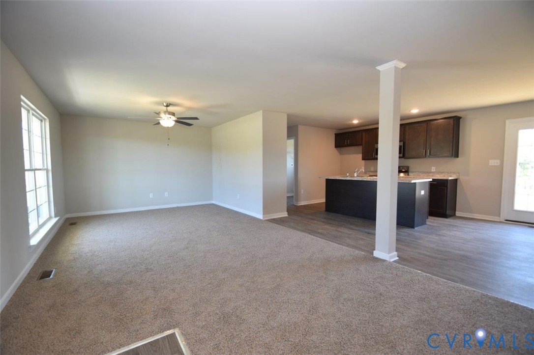 2570 Doctors Road Louisa, VA 23093 - Photo 13 of 17 an empty room with kitchen and window
