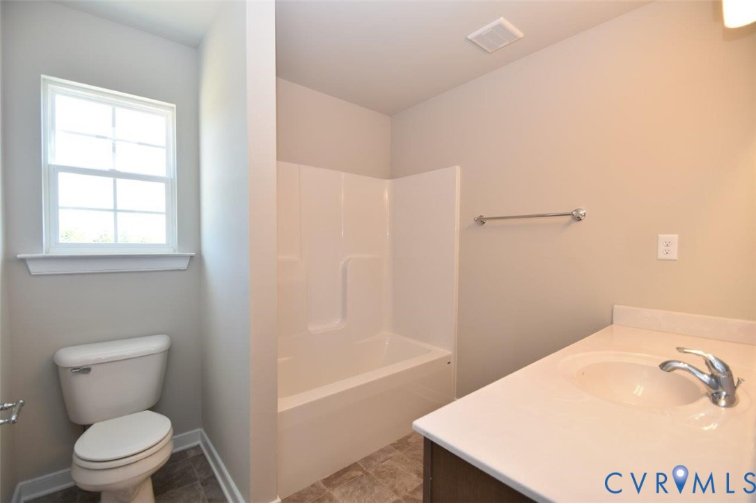 2570 Doctors Road Louisa, VA 23093 - Photo 14 of 17 a bathroom with a sink a toilet and shower