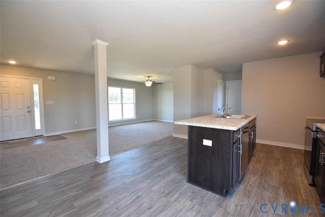 2570 Doctors Road Louisa, VA 23093 - Photo 17 of 17 a kitchen with a sink and wooden floor