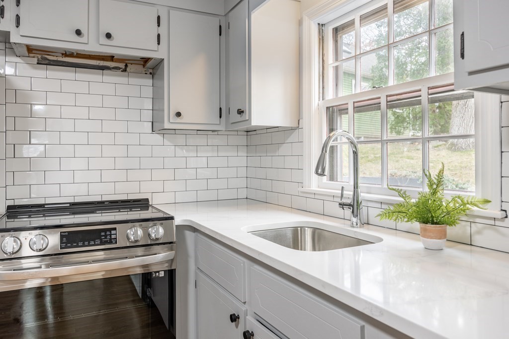 11 Kendall Road Lexington, MA 02421 - Photo 13 of 30 a kitchen with a sink and a stove