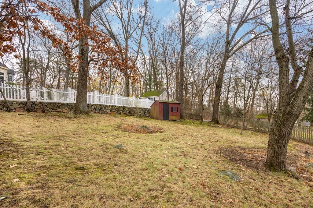 11 Kendall Road Lexington, MA 02421 - Photo 26 of 30 a backyard of a house with large trees