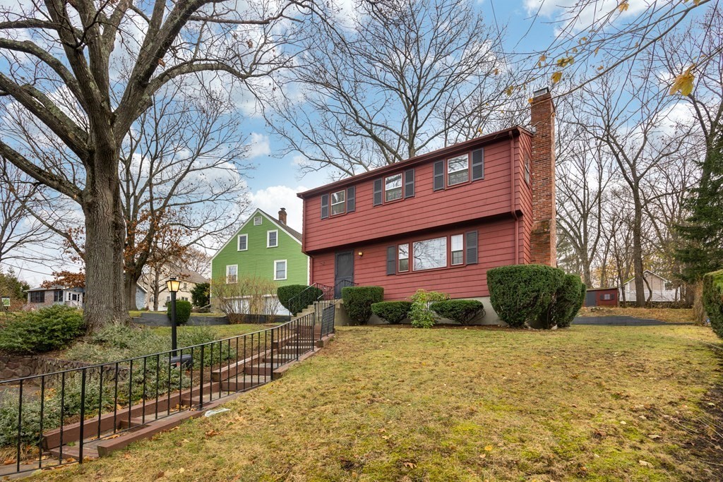 11 Kendall Road Lexington, MA 02421 - Photo 29 of 30 a front view of a house with a yard
