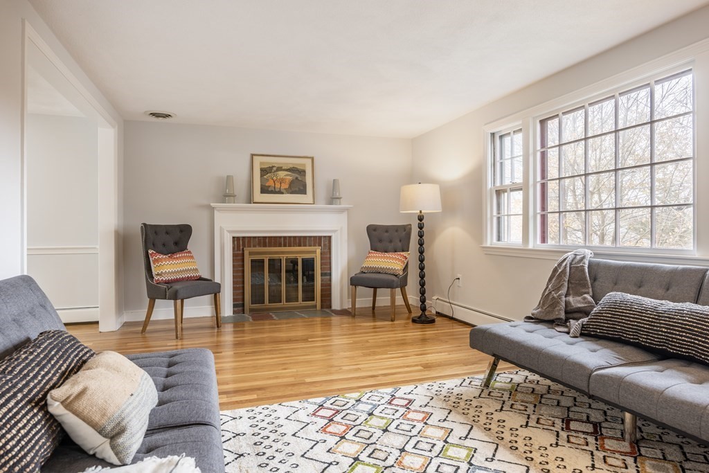 11 Kendall Road Lexington, MA 02421 - Photo 6 of 30 a living room with furniture and a fireplace