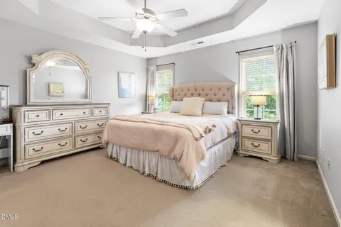a large white bed in a white room