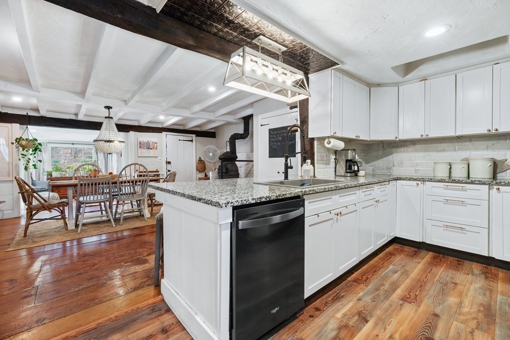 272 Harvard Road Bolton, MA 01740 - Photo 12 of 42 a kitchen with granite countertop white cabinets and white appliances