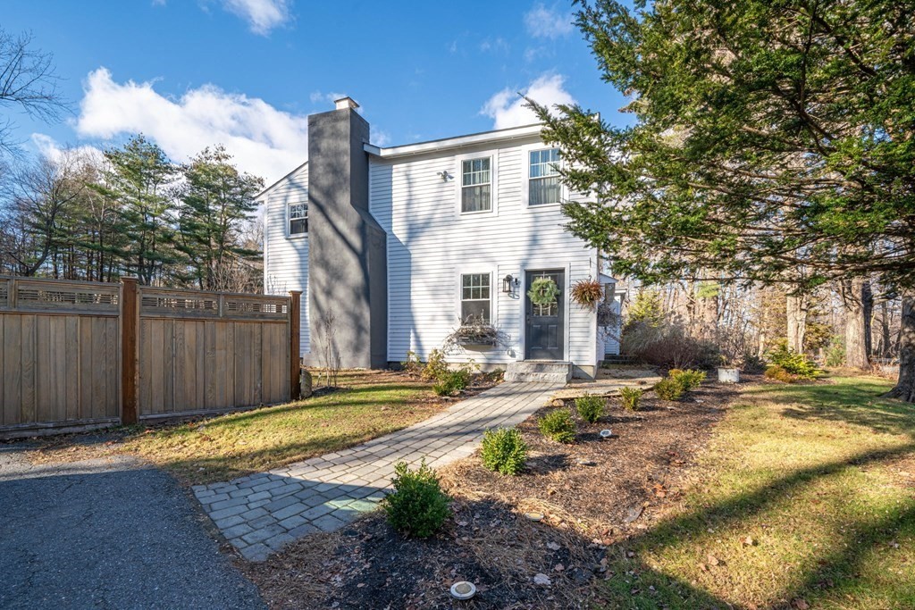 272 Harvard Road Bolton, MA 01740 - Photo 2 of 42 a view of a house with backyard and trees