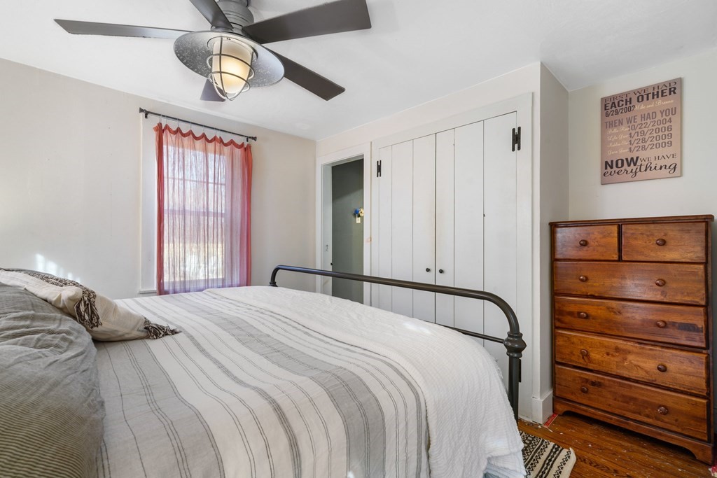 272 Harvard Road Bolton, MA 01740 - Photo 24 of 42 a bedroom with a bed and a dresser