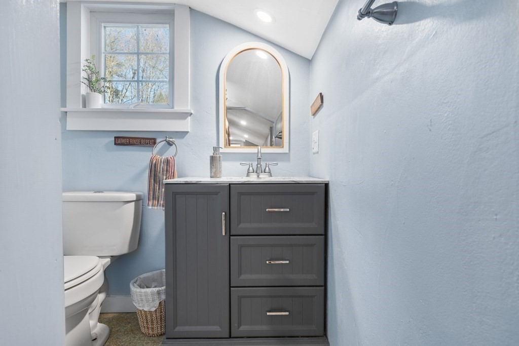 272 Harvard Road Bolton, MA 01740 - Photo 36 of 42 a bathroom with a toilet sink and mirror
